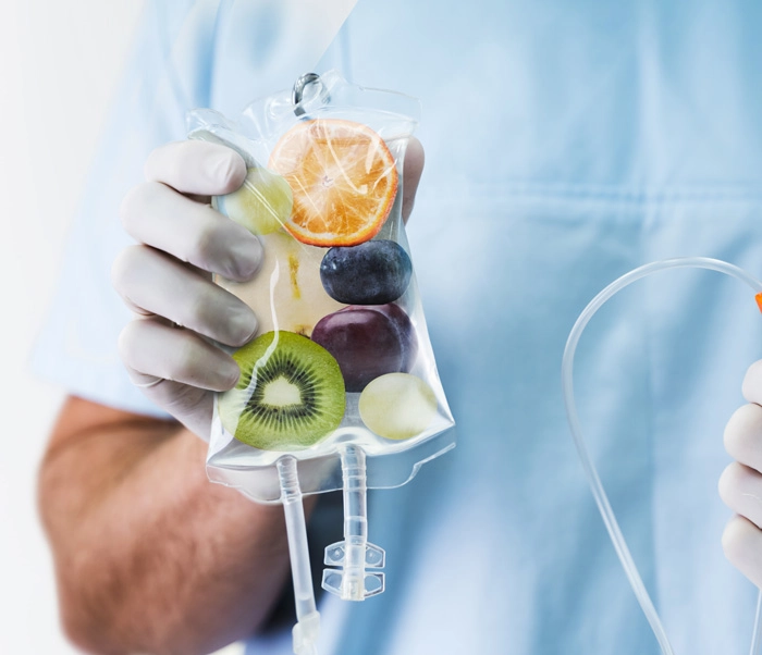 IV Drip Vitamin Infusion Therapy Bag Held By Doctor