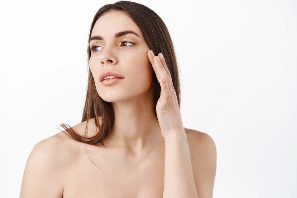 Portrait of young and beautiful woman with perfect smooth skin